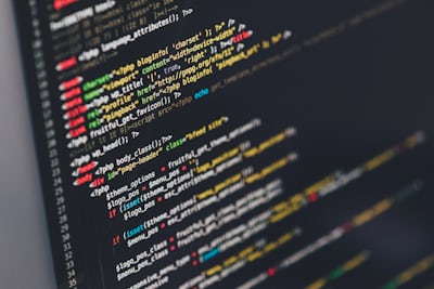 Computer screen showing web design interface with code